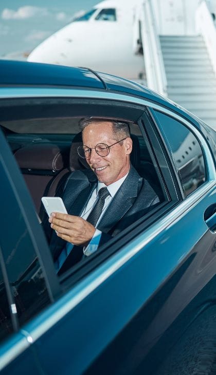 businessman at MSP Airport in sedan Brooklyn Park car service MSP Airport sedan pickup