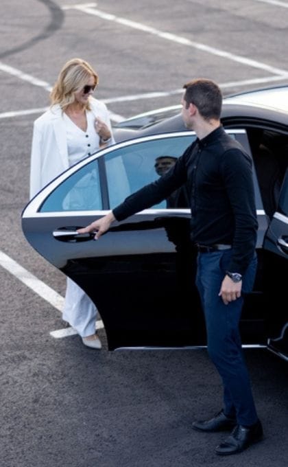 Minneapolis Black Car Service Chauffer And Female Client At Msp